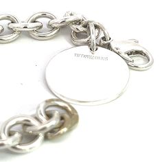 Authentic Tiffany & Co Estate Bracelet 6.75" Sterling Silver TIF526This elegant Authentic Tiffany & Co bracelet is made of sterling silver and has a weight of 33.7 grams.TRUSTED SELLER SINCE 2002PLEASE SEE OUR HUNDREDS OF POSITIVE FEEDBACKS FROM OUR CLIENTS!!FREE SHIPPING!!DETAILSStyle: BraceletLength: 6.75 InchesWeight: 33.7 GramsMetal: Sterling SilverWe try to present our Tiffany estate items as best as possible and most have been newly polished some of the Tiffany items may have a natural pat Classic White Gold Charm Bracelet With Polished Finish, Sterling Silver Bracelet With Polished Finish, Luxury Sterling Silver Charm Bracelet For Formal Occasions, Timeless Silver Bracelet With Shiny Finish, Timeless Sterling Silver Hallmarked Bracelets, Classic Silver Charm Bracelet With Polished Finish, Luxury White Gold Sterling Silver Charm Bracelet, Luxury Polished Sterling Silver Round Bracelet, Luxury Silver Charm Bracelet With Polished Finish