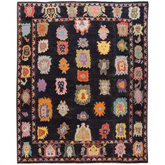 a black rug with many colorful designs on it