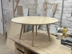 a wooden table sitting on top of a workbench