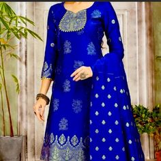 This Suit Has A Sort Of Attractive Blue Art Bananas Silk Pant Style Suit. Once To Wear For Ceremonial. It Comes With A Matching Bottom And Dupatta. Bust- 36 Waist- 37 Hip- 40 Blue Palazzo Set With Unique Design And Long Sleeves, Blue Long Sleeve Self Design Palazzo Set, Blue Long Sleeve Palazzo Set With Self Design, Long Sleeve Blue Sharara With Self Design, Fitted Royal Blue Traditional Wear With Self Design, Blue Long Sleeve Sharara With Self Design, Blue Self Design Palazzo Set For Diwali, Blue Self Design Palazzo Set For Eid, Blue Palazzo Set For Eid With Self Design