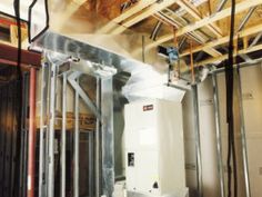 an electrical box in the middle of a room with exposed ceilings and metal bars on the ceiling