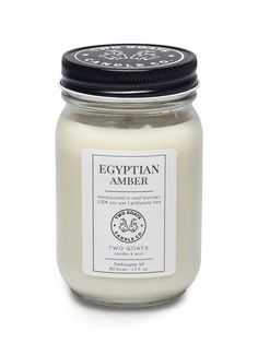 A complex woody blend infused with five essential oils. Egyptian Amber has a rich base of vanilla, dark musk, and sandalwood well balanced by a lively citrus top note. Warm amber and a touch of jasmine make up the heart of the fragrance. It works equally well as a masculine or feminine fragrance. Collect this awesome candle. #scentedcandle #fragrancecandle #soycandles #twogoatscandleco