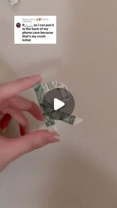 someone is holding money in their hand and the video has been altered to show them how much they love each other