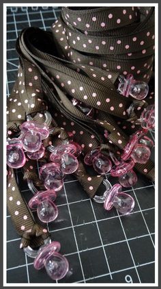 a brown and pink polka dot ribbon on a table