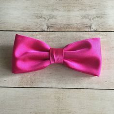 "We proudly present our premium handmade pre-tied bow tie for Adult/Men/Women/Kids/Children/Toddler/Baby boy/girl.... **The bow tie is pre tied and hand stitched into place.** Material: Satin Choose your Bow tie ATTACHMENT/STRAP: - CLIP-ON (strapless) - Adjustable VELCRO strap - Adjustable strap with METAL HOOK, EYE ADJUSTER HARDWARE SIZES are shown below: - NEWBORN-1YR : Adjustable straps fit 7\" up to 11\" neck circumference. - TODDLER (1-3YR) : Adjustable straps fit 10\"-12\" neck circumferen Pre-tied Decorative Bow For Gifts, Pre-tied Bow With Bow Tie Back For Gifts, Classic Pink Bow Tie For Party, Classic Satin Bow Tie As A Gift, Classic Satin Bow Tie For Gift, Pink Satin Bow Tie For Wedding, Pink Bow With Bow Tie Back For Wedding, Pink Bow Tie With Detachable Bow For Party, Classic Satin Bow For Gifts