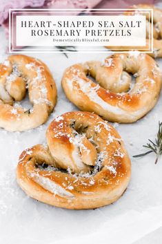 heart - shaped sea salt rosemary pretzels on parchment paper