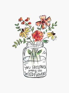 a jar filled with flowers on top of a white surface and the words, you belong among the wildflowers