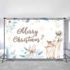 a merry christmas backdrop with two deers and presents in front of the banner that says merry christmas