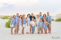 a family poses for a photo on the beach