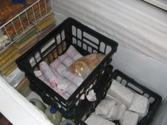 two baskets filled with food sitting on top of a counter next to bottles and containers