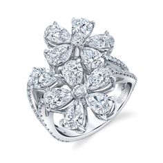 a flower shaped diamond ring on a white background