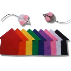 a set of felt houses and mouses on a white background