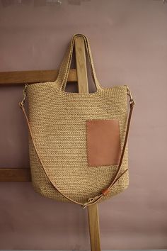 I create premium quality raffia bags. If you order this model of raffia shoulder bag from me, you will definitely fall in love with it. Why? Because this straw tote bag is very comfortable and spacious. Secondly, it is handmade from premium materials for the most discerning and demanding people. And the third reason to buy such a raffia shoulder bag is that it is a trendy model that can be carried in your hands, on your shoulder or over your shoulder. You can use this large straw shoulder bag for a trip to the beach, for a walk in the city, or take it with you on a date. There is a casual straw and leather tote bag for going out for a walk. There is a removable cotton lining with buttons inside the bag. You can easily remove it and wash it. There is a small pocket for small items. The stra Chic Jute Crochet Bag With Leather Handles, Chic Crochet Jute Bag With Leather Handles, Chic Beige Handwoven Hobo Bag, Chic Natural Handwoven Hobo Bag, Jute Bucket Bag With Leather Handles, Beige Straw Bag With Leather Handles, Jute Straw Bag With Double Leather Handles, Jute Shoulder Bag With Braided Handles, Beige Jute Tote Shoulder Bag