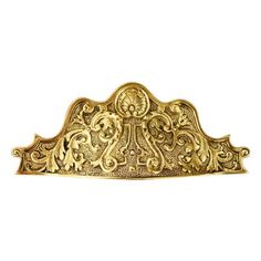 an ornate gold headboard on a white background