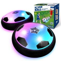 two black and purple soccer balls are in front of a box that says never ball