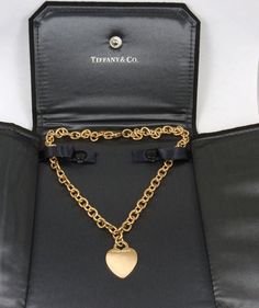 Gorgeous Authentic Tiffany & Co. 18K Yellow Gold Heart Tag Choker Necklace in excellent condition. The Necklace is 16" long. Heart Tag 20.7 mm X 26.8 mmHallmarked "Tiffany & Co. 750". Heavy 51.72 grams. Discontinued and no longer in production. Comes with Tiffany & Co black suede display case.0867 Designer Gold Necklaces For Anniversary, Designer Yellow Gold Necklace For Anniversary, Gold Jewelry For Anniversary In Original Box, Gold Jewelry For Anniversary With Original Box, Gold Wedding Jewelry With Original Box, Classic Formal Necklaces For Valentine's Day, Classic Valentine's Day Formal Necklace, Valentine's Day Classic Formal Necklace, Classic Formal Jewelry With Heart Charm