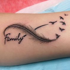 a tattoo with the word family written on it and birds flying in the sky above