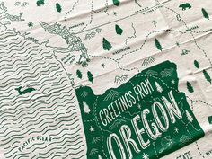 a green and white map with the words greetings from oregon on it's side