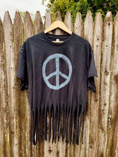 It is a hand made one of a kind hand painted peace sign design on a distress cut tee. The shirt is also frayed at the bottom to give that boho look! It is available in size XL. The shirt color is Ivory.  Please feel free to contact me with any questions or concerns! Semi Crop Top, Peace Sign Hand, Dirty Hippie, Crop Top Shirt, Hippie Shirt, Cut Tees, Crop Top Shirts, Boho Look, Crew Neck Shirt