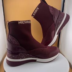 Item #20420778 From Michael Kors, The Swift Stretch Knit Sneaker Booties Feature: Stretch Knit/Mesh/Leather/Crocodile Embossed Synthetic Upper Pull On Back Pull Loop Textile Lining Rubber Outsole Approx. 2" Speckled Wedge Heel Imported. Dms: 0655 331 43f1swfe7d Slip-on Sneakers With Red Sole And Round Toe, Casual Boots With Red Sole In Synthetic Material, Casual Boots With Red Sole, Sporty Synthetic Slip-on Boots, Knit Mesh, Knit Sneakers, Michael Kors Shoes, Wedge Heels, New Color