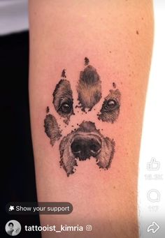 a dog's paw is shown with the word, show your support tattoo on it