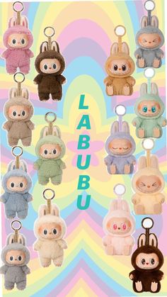 several small stuffed animals hanging from hooks on a colorful background with the words labuu