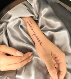 a woman's arm with the words happy new year written on her left hand