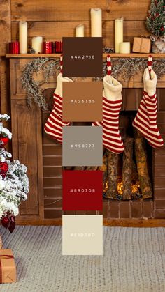 christmas stockings hanging in front of a fireplace with red and white striped stockings on them