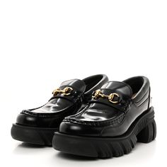 This is an authentic pair of GUCCI Magnum Calfskin Nappa Samoa Womens Horsebit Platform Chunky Lug Sole 40mm Loafers size 38 in Black. These loafers are crafted of shiny calfskin leather in black. The shoes feature a 1.25-inch platform, an aged gold horsebit detail on the top, and a 2.5-inch heel. 5 Inch Heels, Samoa, Lug Sole, Calf Skin, Loafers, Thing 1, Gucci, Heels, Leather