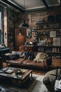 a living room filled with furniture and a brick wall in the back drop off area