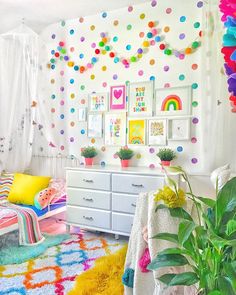 a bedroom decorated in bright colors and lots of confetti