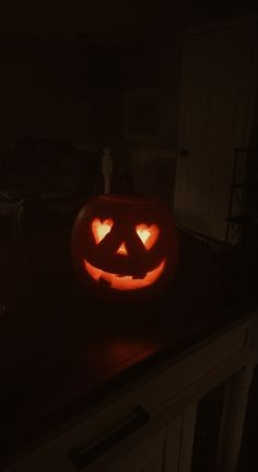 a carved pumpkin sitting on top of a counter