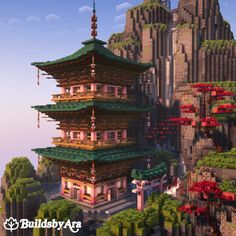 a tall building sitting on top of a lush green hillside next to a mountain covered in trees