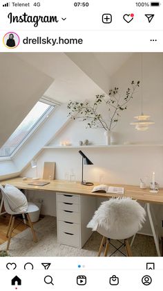 an attic office with white furniture and lots of natural light