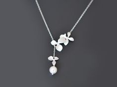 SALE Orchid necklace Flower necklace Pearl by TheMichelleJewelry Wedding Necklace With Adjustable Chain And Flower Pendant, Wedding Flower Pendant Necklace With Charm, Wedding Pendant Flower Charm Necklace, Wedding Flower-shaped Jewelry With Delicate Chain, Dainty Flower Pendant Necklace For Wedding, Silver Lariat Necklace With Pearl Pendant For Wedding, Silver Pearl Pendant Lariat Necklace For Wedding, Wedding Necklace With Flower Charm, Wedding Necklace With Delicate Flower Chain