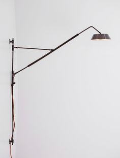 a lamp that is on top of a wall