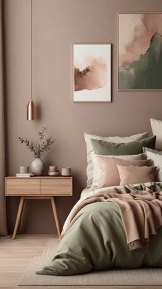 a bed in a bedroom with two paintings on the wall above it and a wooden nightstand