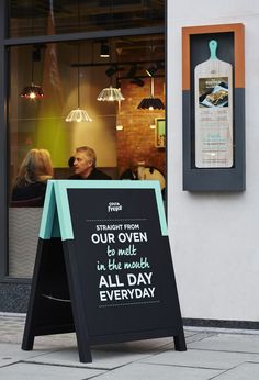 a sign in front of a restaurant that says, our menu is open and we're all day everyday