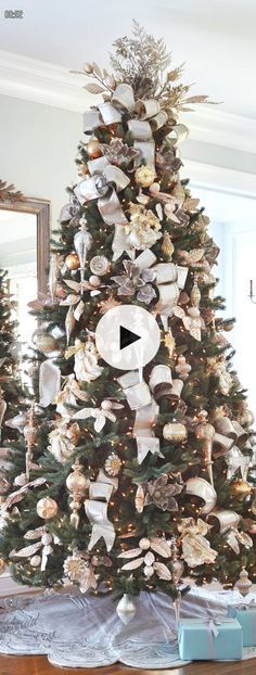 a decorated christmas tree with ribbons and bows