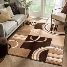 a living room with a couch, chair and rug