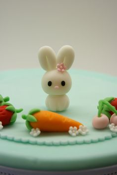 there is a cake that has been made to look like rabbits and carrots