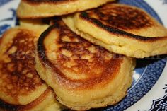 some pancakes on a blue and white plate