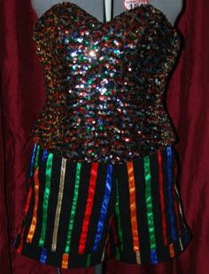 a mannequin with colorful sequins on it's bust and shorts