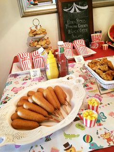 a table topped with lots of food and snacks