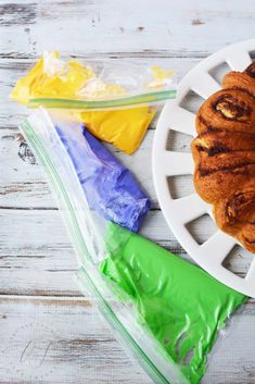 a bundt cake sitting on top of a white plate next to plastic wrappers