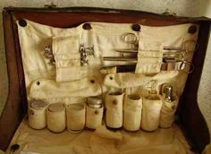 an old suitcase filled with jars and other items