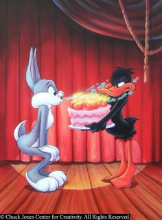 an image of bugs and tails on stage with the cake being served to each other