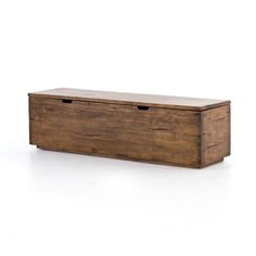 a wooden box sitting on top of a white floor