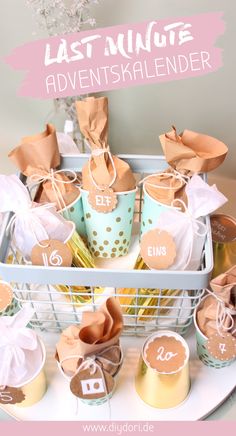 a basket filled with lots of cupcakes on top of a table