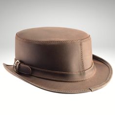 Fitted Brown Brimmed Top Hat, Western Style Leather Fitted Top Hat, Fitted Short Brim Hat For Riding, Leather Top Hat With Curved Brim For Rodeo, Vintage Leather Top Hat With Flat Crown, Fitted Leather Top Hat With Short Brim, Vintage Brown Top Hat With Flat Crown, Fitted Brown Top Hat With Short Brim, Brown Leather Top Hat With Curved Brim